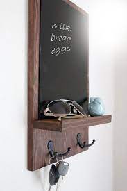 This entry way organizer uses embedded magnets to hold your keys while an elastic band keeps sunglasses at the ready. Chalkboard Key Holder Chalkboard Organizer Rustic Chalkboard Entry Organizer Key Holder Kitchen Deco Chalkboard Organizer Trending Decor Rustic Chalkboard