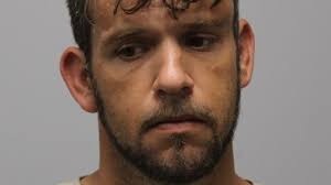 Man charged with stabbing another man with 2 children present