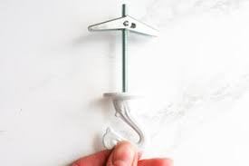 While holding the drill perpendicular to the ceiling surface press the trigger and begin to drill into the concrete, using the hammer action option on the drill, says wrench guru. How To Hang A Plant From The Ceiling 5 Steps With Pictures Instructables