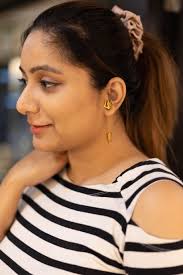 Golden Trishul Earrings by Pratha