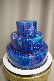 Black And White Mirror Glaze Cake Blue Pink Purple White Mirror Glaze On Three Tier Cake Cake Glaze Recipe Placed On White And Gold Cake Stand In 2020 Galaxy Cake Cake Galaxy Wedding