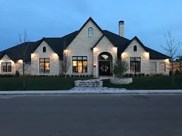 Black And White House Exterior One Story White Stone With Black Trim Brick Exterior House Stone Exterior Houses House Exterior