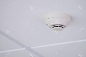 Installing a smoke detector can save your life. White Smoke Detector Installed On Tile Ceiling Stock Photo Picture And Royalty Free Image Image 132631315