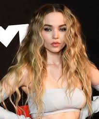 Dove Cameron Long Wavy Dark Blonde Hairstyle with Light Blonde Highlights