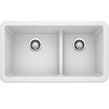 This is enough of a divide to fill one side up with dishwater, but not enough to create a racket while washing. Blanco 402324 Ikon 33 Inch Apron Low Divide In White