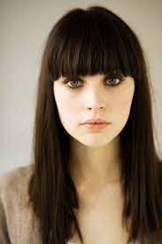 Many women choose to wear bangs if they want to cover the these long bangs are fanned out across the forehead in a way that makes a high loose bun updo super chic. Trend To Try Blunt Bangs Dark Hair Straight Across Bangs Hairstyles With Bangs