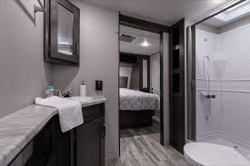 The full bath and queen bed are in the front master. Transcend Xplor 245rl Grand Design