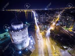 Δραματικη νυχτα για την θεσσαλονικη. Aerial View Of Famous White Tower And The City Of Thessaloniki At Night Greece Image Taken With Action Drone Camera Causing Distortion And Blur Stock Photo Picture And Royalty Free Image Image