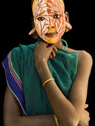 The face painting of this woman who is a member of the Turi tribe in  Ethiopia is so distinct. When I made the image, I recall being struck by  the twig-like pattern