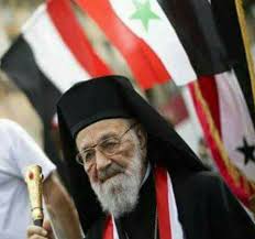 images?q=tbn:ANd9GcQ04P5aCWQUtfu83N98AX-6yAJHgr9dDQBGZ3ESD4fsQToJi-xNIg المطران "كبّوجي " في ذمّة الصمت العربي على المأساة المتنقلة