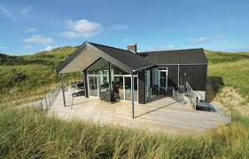 Falls ihr nächster urlaub sie nach dänemark führen wird, dann sind sie hier genau richtig. Ein Architekt Entwarf Dieses Ferienhaus In Einzigartiger Lage In Naturlicher Lage Mitten In Den Schonen Dunen Von Blokhus Ferienhaus Ferienhaus Danemark Haus