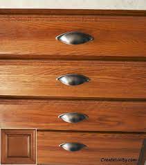 When staining oak cabinets, consider colors such as golden oak, maple, colonial oak, and pecan. Planning For Will Honey Oak Cabinets Come Back In Style Oakkitchencabinets Cabinets Kitchen Remodel Cost Cheap Kitchen Remodel Kitchen Remodel Pictures