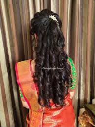 This is among best wedding hairstyles for round faces for those who are attending a wedding in middle age. Pretty Curls South Indian Bridal Hairstyle By Swank Curls With Hair Accessory Bridal Indian Wedding Hairstyles Indian Bridal Hairstyles Reception Hairstyles
