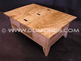 The noguchoff coffee table is a casual and playful rendition of an iconic table through new line, surface, and color. Rustic Curly Maple Slab Coffee Table With Ebony Butterflies