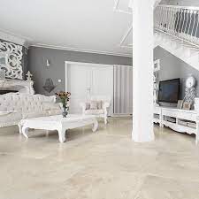 The house only has one living space, that flows into the dining room, that has multiple uses. Cappuccino Polished Marble Tiles 18x18