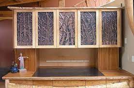 Here are ten kitchen cabinet door material options to help you decide on what to use for your refacing project a hardwood that is often used for floorings and furniture, red oak is a great material choice for kitchen cabinets as well. Allen Mary Dee Make Art Copper Cabinet Fronts Cabinet Fronts Kitchen Projects Frameless Kitchen Cabinets