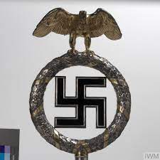 The flag background is red silk with white ribbed silk circle in the middle with a black silk swastika with silver bullion ribbon out line. Standard Top Deutschland Erwache Germany Awake Imperial War Museums
