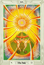 A large, bright sun shines in the sky, representing the source of all life on earth. The Sun Thoth Tarot Card Meanings Aleister Crowley Tarotx