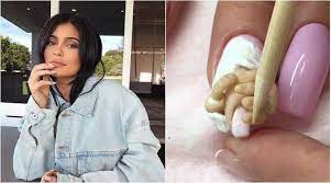 In the second photo, kylie poses with stormi sitting on her, innocently looking at the camera. Video This Kylie Jenner And Stormi Inspired Manicure Is Grossing People Out Trending News The Indian Express