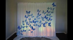 A wedding decorated around the idea of butterflies. Butterfly Backdrop Diy Butterfly Baby Shower Theme Butterfly Theme Party Butterfly Themed Birthday Party