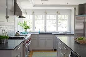 The white sink is sculpted from fireclay and exposed to extreme temperatures. 33 Sophisticated Gray Kitchen Ideas Chic Gray Kitchens