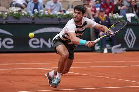 Carlos Alcaraz eases to straight-sets victory in French Open defence | The Independent