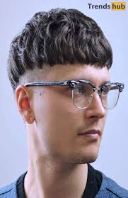 Another small touch is that the fringe isn't perfectly straight cut, but rather created by the hair falling forward. 10 Best Edgar Haircuts For Men