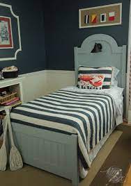 It has a great chalkboard at the top for messages and hangers at the bottom to help you keep things organized. Diy Headboard And Footboard With Beadboard And Nautical Light The Kim Six Fix