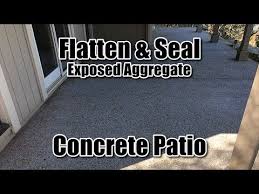 Concrete is made of aggregate (usually sand and gravel) that is mixed and bonded together by cement and water and used in construction through the use of structural concrete, slab construction, stair construction and other architectural features. Flatten And Seal Exposed Aggregate Concrete Patio Youtube