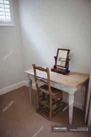 Maybe you would like to learn more about one of these? Empty Table And Chair With Mirror In Bedroom At Home Furniture Authentic Stock Photo 225297276