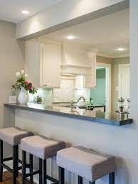 The combination of a light backsplash, paired with dark wood cabinetry and countertops, open up the area. Our Favorite Fixer Upper Kitchen Makeovers Kitchen Remodel Small Kitchen Remodel Layout Home Kitchens