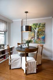 Inspiration for a contemporary dining room in sydney with white walls, dark hardwood floors and black floor. Small Dining Tables Houzz