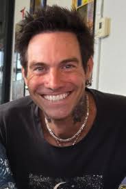 Does blues traveler member resemble another person?