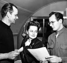 olivia de havilland with armed forces radio announcer al kersey left and bob gordon she is in t olivia de havilland olivia de havilland sister de havilland
