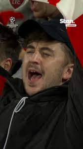 𝘠𝘰𝘶’𝘭𝘭 𝘕𝘦𝘷𝘦𝘳 𝘞𝘢𝘭𝘬 𝘈𝘭𝘰𝘯𝘦 𝐁𝐄𝐋𝐓𝐄𝐃 out at the top of  every Liverpool fan’s lungs at Anfield 🎶🗣️, A mega clash against Real  Madrid awaits for the Reds., ↳ UEFA Champions League. Live & Exclusive