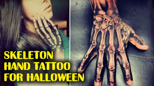 Skeleton's hand tattoo looks exceptionally beautiful etched in black with some shading work. Skeleton Hand Tattoos For Halloween Youtube