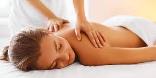 Female message therapist giving a. Massage Therapy Centennial Physio Therapy