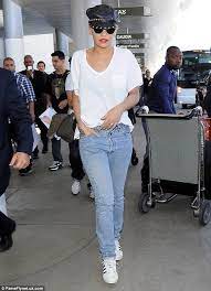 Rita Ora Keeps It Simple In White T Shirt And Jeans T Shirt And Jeans White Top And Jeans Wedding Finger