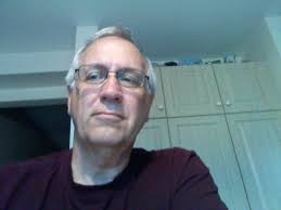 Can I charge the EK 7000 PRO while using the camera?