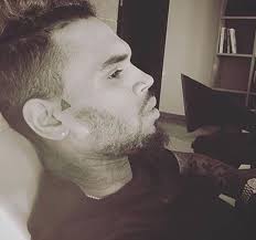 Breezy hasn't shared the significance of the tattoo, but i'm just going to guess it's a baby jordan shoe…maybe for aeko?! Chris Brown Tattoos On His Head
