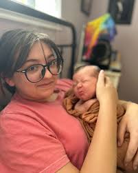 One month of loving you Baby Jamie. You are settling quite well into our  family. You hate your car seat and rides around town. You love contact  napping