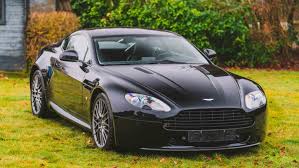 Image result for Jet Black 2010 Aston Martin