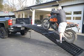 I bought the cheapest harbor freight ramps (2 per). Black Widow Aluminum 12 Foot 4 Beam Folding Arched Ramp Review Adventure Motorcycle Magazine