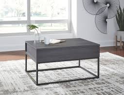 A table with form and function, and a whole lot of style, is what the valibry lift top cocktail table is all about. The Yarlow Black Lift Top Cocktail Table Available At Royal Star Furniture Serving St Paul Mn