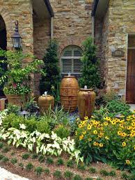 How to plant flowers in large planters 13 photos. 20 Ideas For Using Large Garden Containers Hgtv