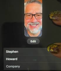 Who is the man in the photo with Howard?