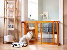 For larger breeds and furry pals who love to leap over obstacles, tall dog gates might be an appropriate option. China 34 46inches Wide 19inches Tall Dog Gate With Door Walk Through Adjustable Freestanding Wooden Pet Gate Step Over Fence For Small To Medium Sized Pets Dogs Ba China Pet