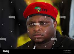Economic Freedom Fighters Commissar for Political Education Floyd Shivambu  listens to supporters before handing over a house Stock Photo