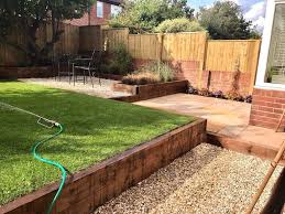 Completed Garden Split Level Garden Timber Sleepers And Natural Sandstone Wi Completed Garden Garden Ideas Split Level Sloped Garden Modern Backyard