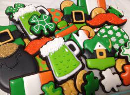 To decorate cookies, hold cookie by its edge and dip top of cookie into icing. St Patricks Day Shamrocks Pot Of Gold Leprechaun Ireland Green Beer Sugar Cookies St Patrick S Day Cookies Spring Cookies Beer Cookies